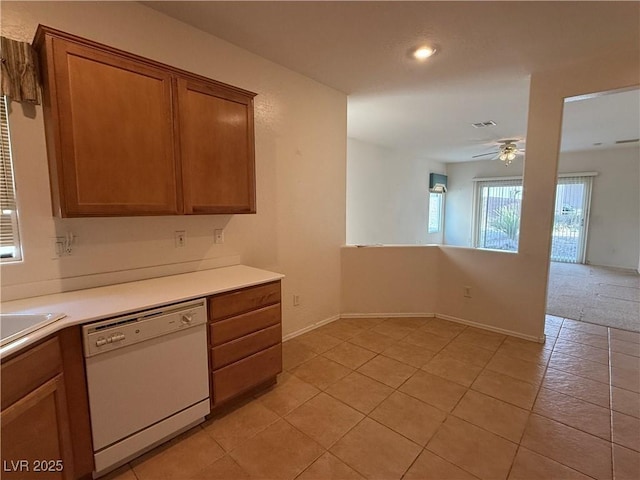3508 Kittiwake Rd, North Las Vegas, NV 89084 - kitchen featuring dishwasher, ceiling fan, brown cabinetry, light countertops, and light tile patterned floors