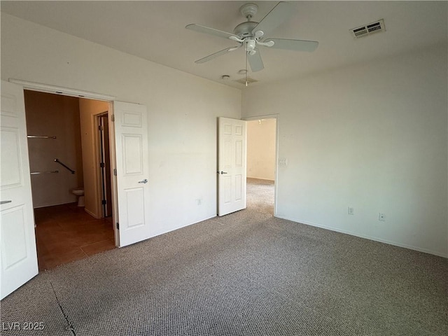 3508 Kittiwake Rd, North Las Vegas, NV 89084 - unfurnished bedroom featuring carpet, connected bathroom, ceiling fan, and baseboards