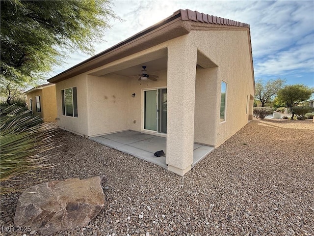 3508 Kittiwake Rd, North Las Vegas, NV 89084 - back of house featuring ceiling fan, stucco siding, and a patio area