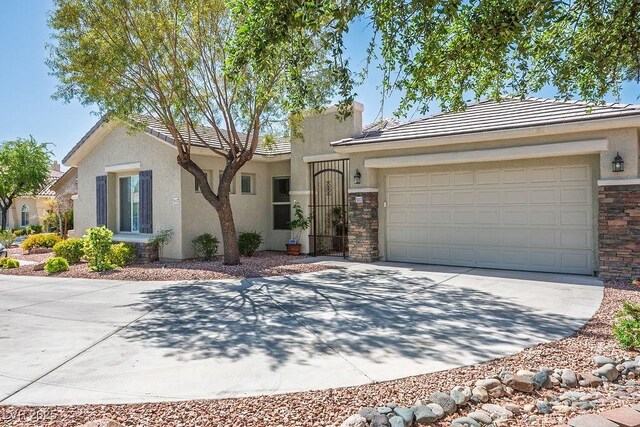 5017 Kaibab Forest Ave, Las Vegas, NV 89141 - view of front of property with stucco siding, driveway, a tiled roof, and an attached garage