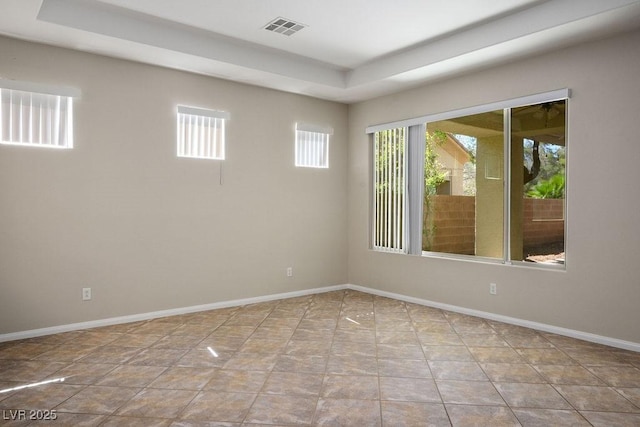5017 Kaibab Forest Ave, Las Vegas, NV 89141 - spare room with a tray ceiling, plenty of natural light, and baseboards