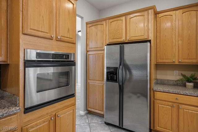 5017 Kaibab Forest Ave, Las Vegas, NV 89141 - kitchen featuring appliances with stainless steel finishes and light tile patterned floors