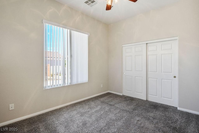 5017 Kaibab Forest Ave, Las Vegas, NV 89141 - unfurnished bedroom with dark carpet, baseboards, a closet, and ceiling fan