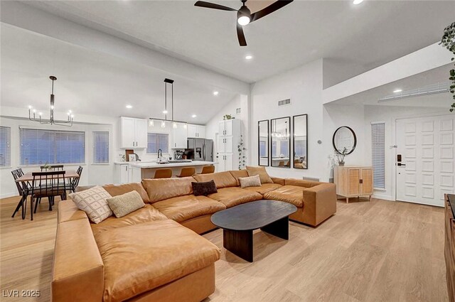 58 Pleasant Dale Dr, Henderson, NV 89074 - living area with light wood-style floors, a chandelier, a ceiling fan, recessed lighting, and high vaulted ceiling