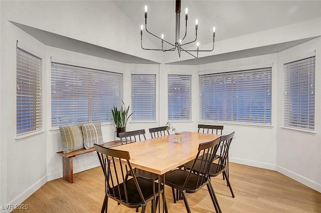 58 Pleasant Dale Dr, Henderson, NV 89074 - dining area featuring light wood-style flooring, a chandelier, and baseboards