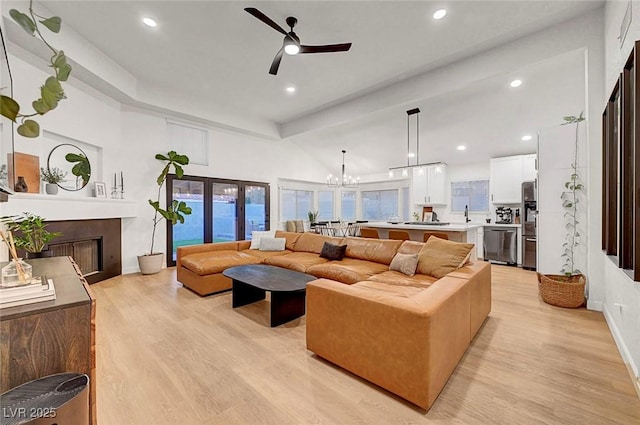 58 Pleasant Dale Dr, Henderson, NV 89074 - living area featuring light wood finished floors, ceiling fan, baseboards, recessed lighting, and a fireplace