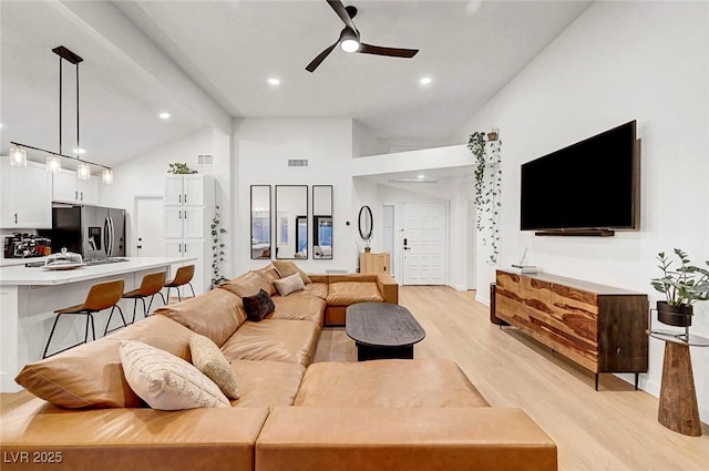 58 Pleasant Dale Dr, Henderson, NV 89074 - living room featuring a ceiling fan, light wood-style floors, beam ceiling, recessed lighting, and high vaulted ceiling