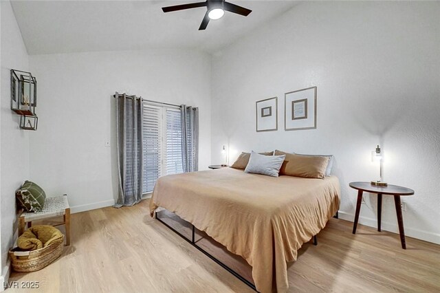 58 Pleasant Dale Dr, Henderson, NV 89074 - bedroom with lofted ceiling, light wood-style floors, baseboards, and a ceiling fan
