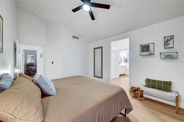 58 Pleasant Dale Dr, Henderson, NV 89074 - bedroom featuring light wood-type flooring, ceiling fan, ensuite bathroom, and high vaulted ceiling