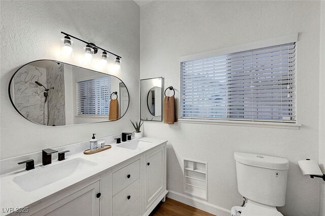 58 Pleasant Dale Dr, Henderson, NV 89074 - full bath with double vanity, a shower, toilet, and wood finished floors