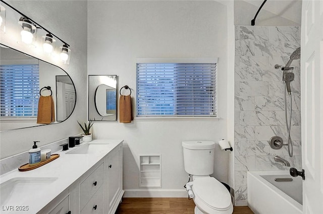 58 Pleasant Dale Dr, Henderson, NV 89074 - bathroom featuring double vanity, toilet, baseboards, wood finished floors, and shower / bathtub combination