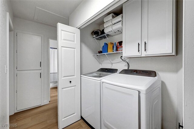 58 Pleasant Dale Dr, Henderson, NV 89074 - laundry room with light wood-type flooring, cabinet space, washer and clothes dryer, and attic access