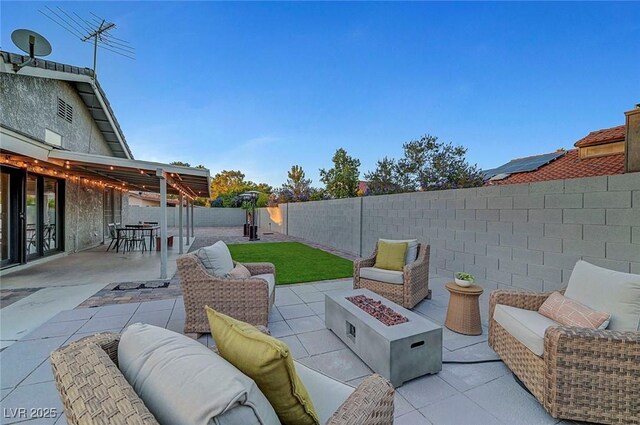 58 Pleasant Dale Dr, Henderson, NV 89074 - fenced backyard with a patio area, an outdoor living space with a fire pit, and outdoor dining area