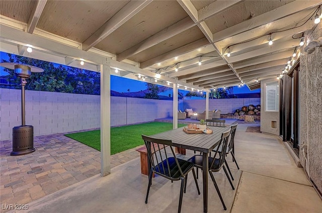 58 Pleasant Dale Dr, Henderson, NV 89074 - patio at night featuring outdoor dining space and a patio area