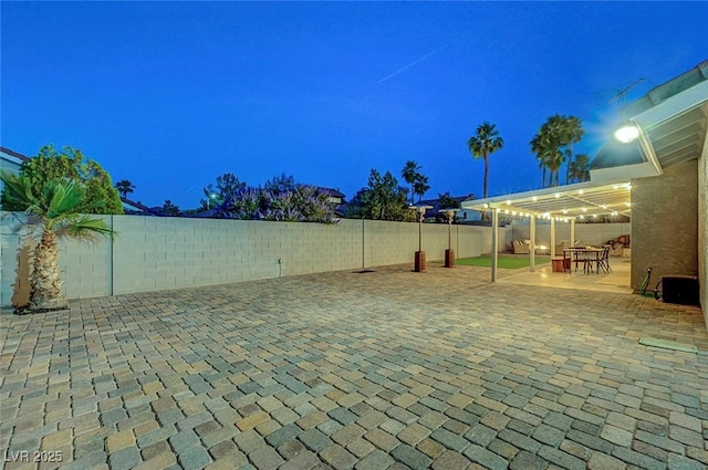 58 Pleasant Dale Dr, Henderson, NV 89074 - patio at night featuring a patio area, a fenced backyard, and a pergola