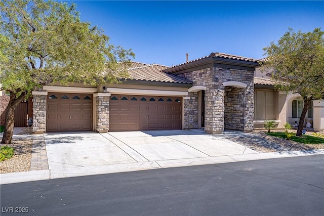 8544 Garden Valley Ct, Las Vegas, NV 89178 - view of front of property featuring a garage, concrete driveway, stone siding, and a tiled roof