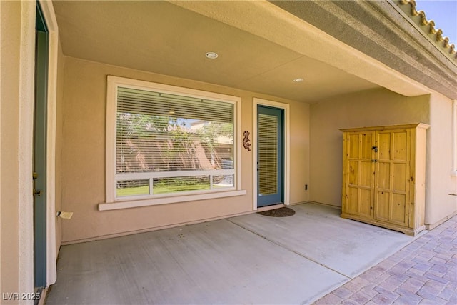 8544 Garden Valley Ct, Las Vegas, NV 89178 - entrance to property with stucco siding and a patio