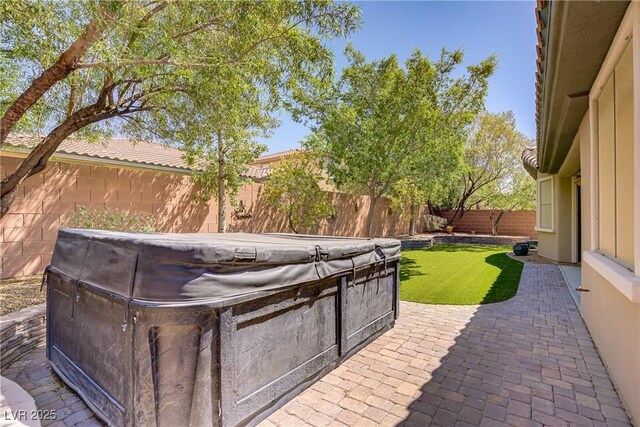 8544 Garden Valley Ct, Las Vegas, NV 89178 - fenced backyard with a hot tub and a patio