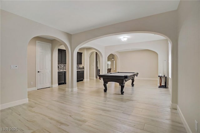 8544 Garden Valley Ct, Las Vegas, NV 89178 - rec room with light wood-style floors, billiards, baseboards, and arched walkways