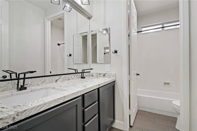 8544 Garden Valley Ct, Las Vegas, NV 89178 - full bathroom with double vanity, toilet, tile patterned floors, and bathing tub / shower combination