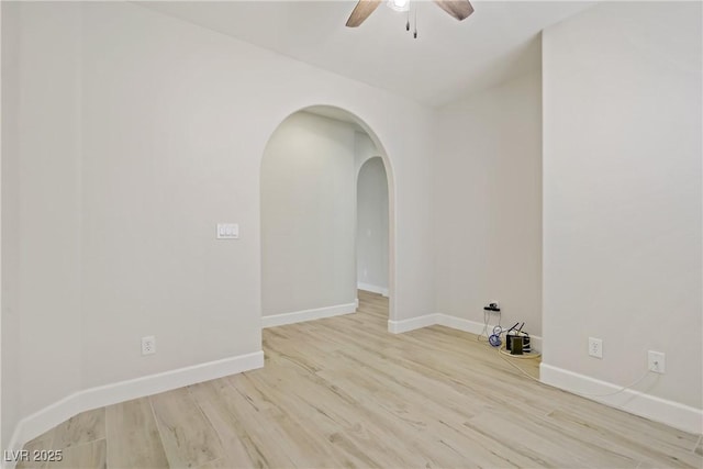 8544 Garden Valley Ct, Las Vegas, NV 89178 - spare room featuring ceiling fan, wood finished floors, arched walkways, and baseboards