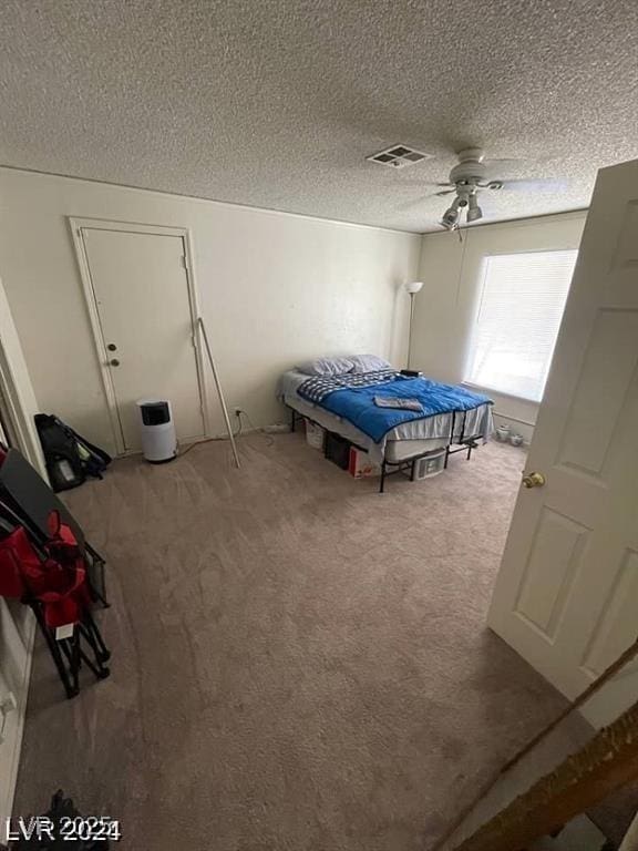 45 Logan Ct, Las Vegas, NV 89110 - bedroom featuring carpet floors, a ceiling fan, and a textured ceiling