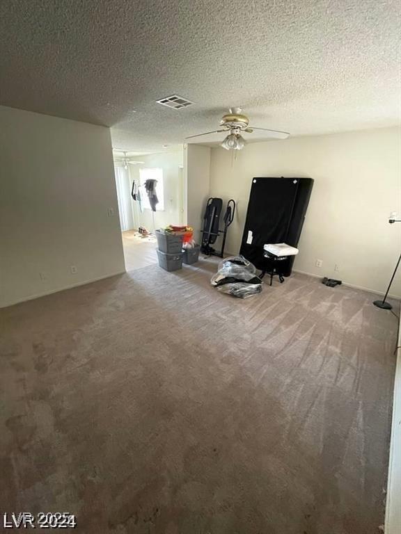 45 Logan Ct, Las Vegas, NV 89110 - living room with ceiling fan, carpet, and a textured ceiling