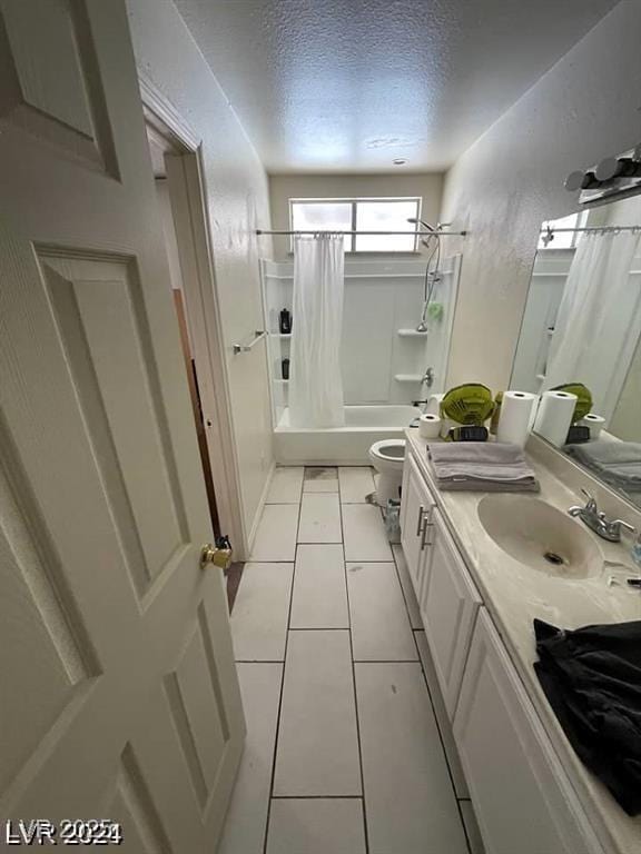 45 Logan Ct, Las Vegas, NV 89110 - full bathroom with toilet, vanity, shower / tub combo with curtain, a textured ceiling, and tile patterned floors