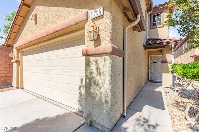 11755 Garland Grove Ln, Las Vegas, NV 89183 - garage featuring concrete driveway