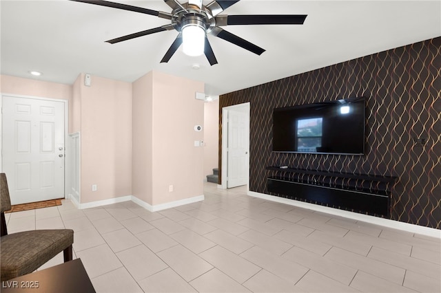 11755 Garland Grove Ln, Las Vegas, NV 89183 - unfurnished living room with an accent wall, ceiling fan, baseboards, recessed lighting, and light tile patterned floors