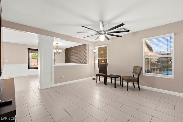 11755 Garland Grove Ln, Las Vegas, NV 89183 - living area featuring a chandelier and a ceiling fan