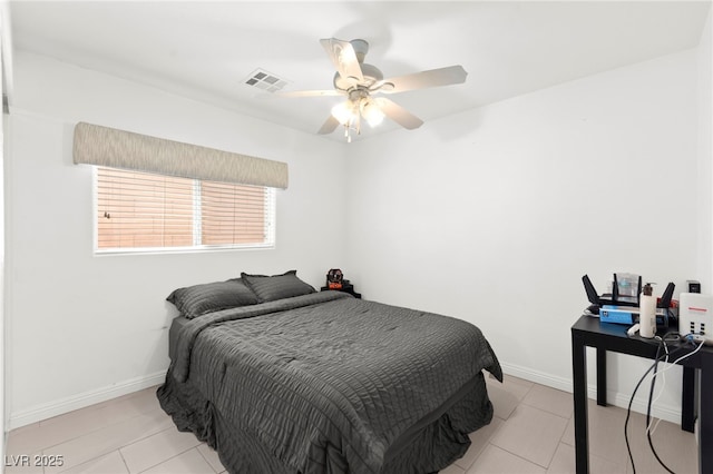 11755 Garland Grove Ln, Las Vegas, NV 89183 - bedroom with light tile patterned floors, a ceiling fan, and baseboards
