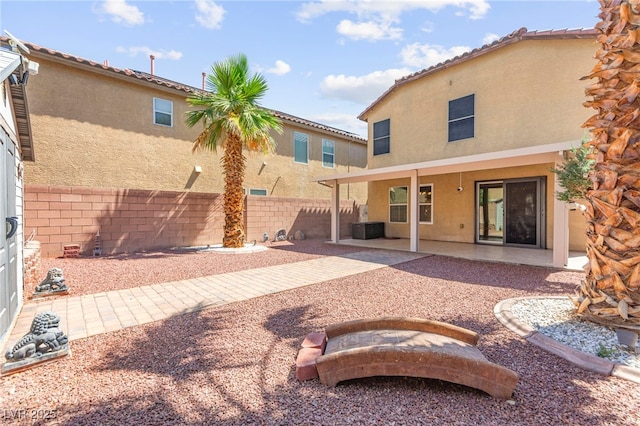 11755 Garland Grove Ln, Las Vegas, NV 89183 - rear view of house featuring stucco siding and a patio