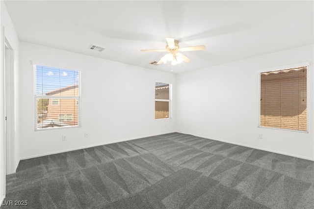 11755 Garland Grove Ln, Las Vegas, NV 89183 - unfurnished room with dark carpet, ceiling fan, and baseboards