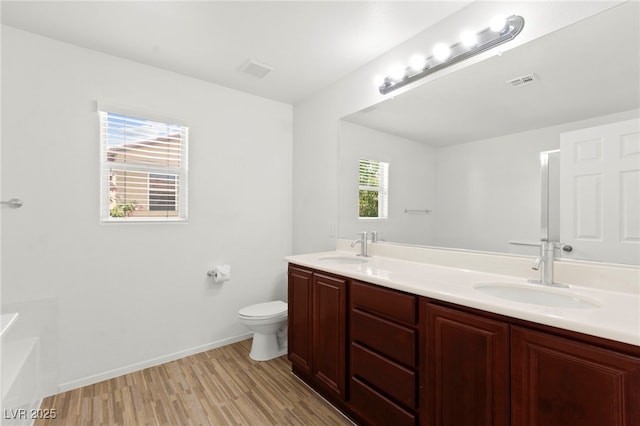 11755 Garland Grove Ln, Las Vegas, NV 89183 - full bath with wood finished floors, double vanity, toilet, and baseboards