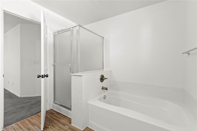 11755 Garland Grove Ln, Las Vegas, NV 89183 - bathroom featuring a bath, wood finished floors, and a shower stall