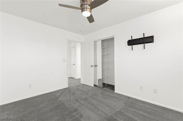 11755 Garland Grove Ln, Las Vegas, NV 89183 - unfurnished bedroom with dark carpet, baseboards, a closet, and a ceiling fan