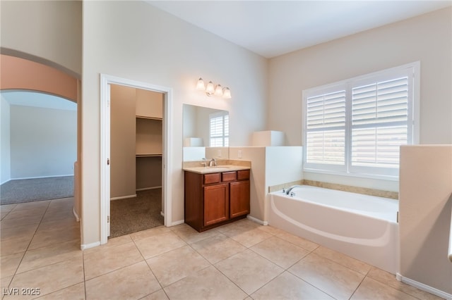 6125 Paddleboat St, North Las Vegas, NV 89031 - full bath featuring vanity, tile patterned floors, a bath, and baseboards