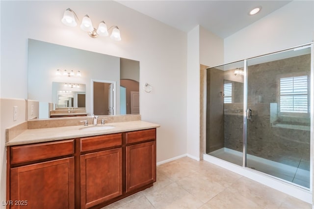 6125 Paddleboat St, North Las Vegas, NV 89031 - full bathroom featuring vanity, tile patterned floors, a shower stall, and baseboards