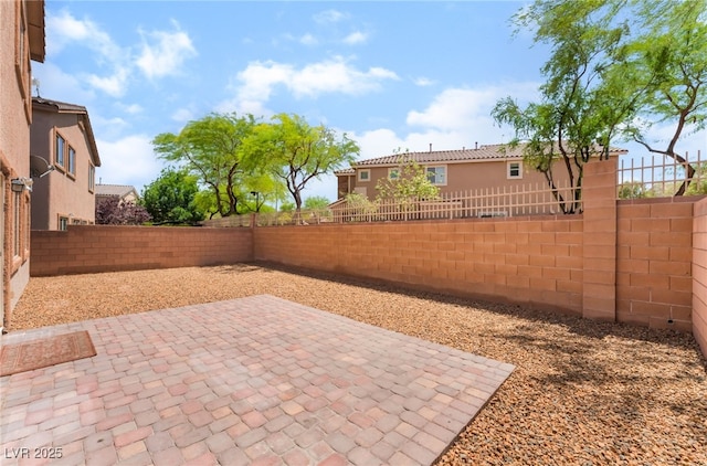 6125 Paddleboat St, North Las Vegas, NV 89031 - fenced backyard with a patio