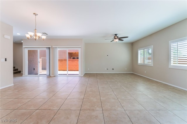 6125 Paddleboat St, North Las Vegas, NV 89031 - empty room with a chandelier, light tile patterned floors, a ceiling fan, baseboards, and stairway