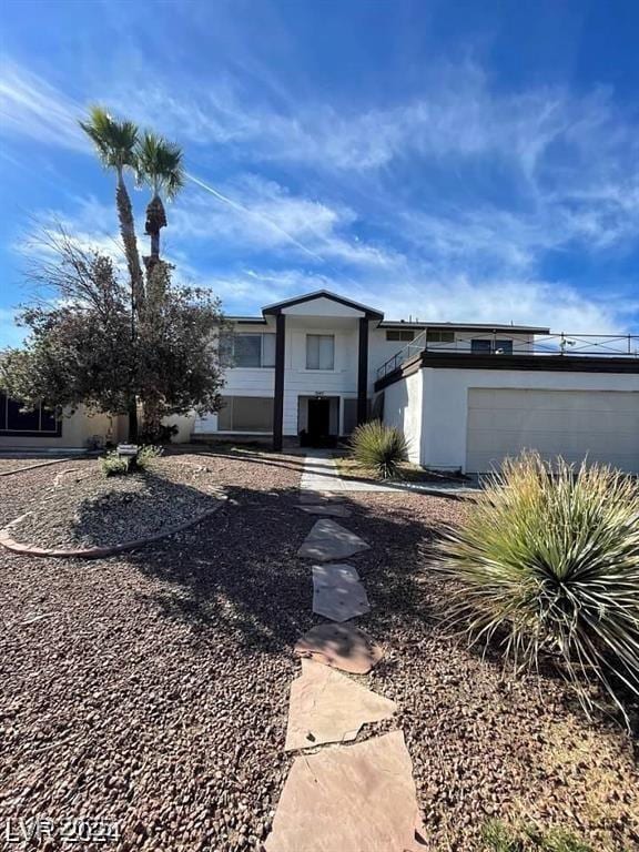 5243 Sunnywood Dr, Las Vegas, NV 89120 - view of front of property with stucco siding and an attached garage