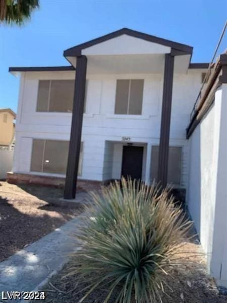 5243 Sunnywood Dr, Las Vegas, NV 89120 - view of front of home with stucco siding