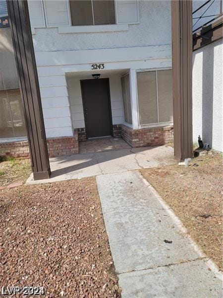5243 Sunnywood Dr, Las Vegas, NV 89120 - property entrance with brick siding