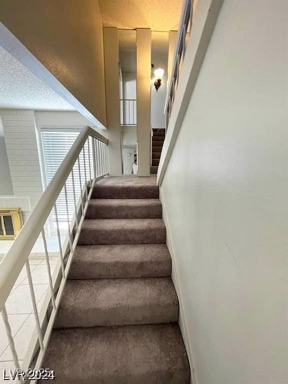 5243 Sunnywood Dr, Las Vegas, NV 89120 - staircase with carpet and baseboards