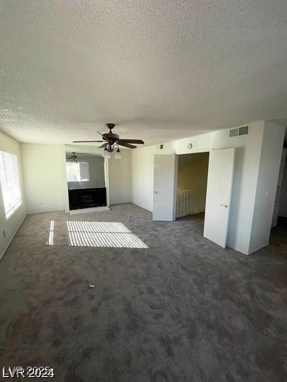 5243 Sunnywood Dr, Las Vegas, NV 89120 - unfurnished living room with a textured ceiling, ceiling fan, and carpet floors