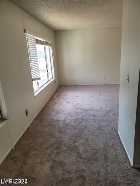 5243 Sunnywood Dr, Las Vegas, NV 89120 - unfurnished room with carpet flooring and a textured ceiling