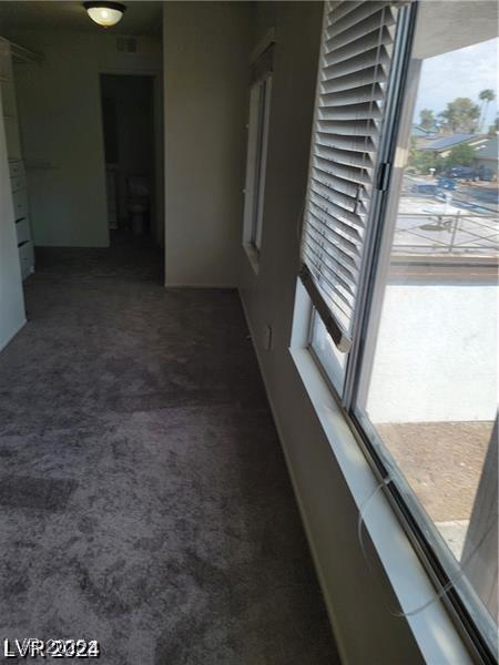 5243 Sunnywood Dr, Las Vegas, NV 89120 - hallway with carpet floors