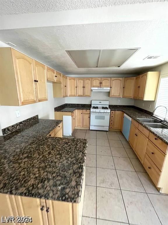 5243 Sunnywood Dr, Las Vegas, NV 89120 - kitchen with white appliances, a sink, under cabinet range hood, light brown cabinets, and a textured ceiling