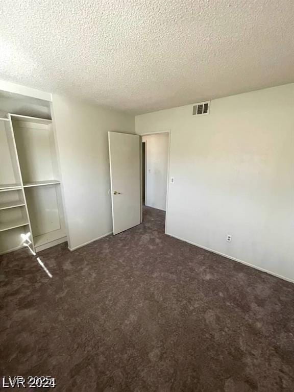 5243 Sunnywood Dr, Las Vegas, NV 89120 - unfurnished bedroom with a textured ceiling, carpet flooring, and a closet